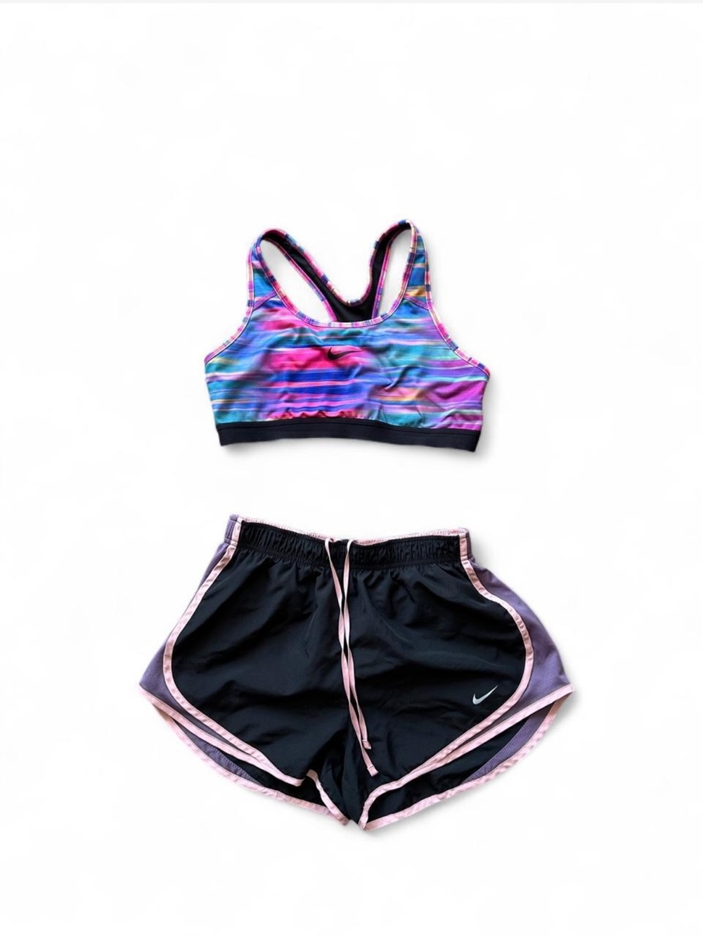 Nike multi-colored sports bra and shorts set with pink, purple, and blue gradien